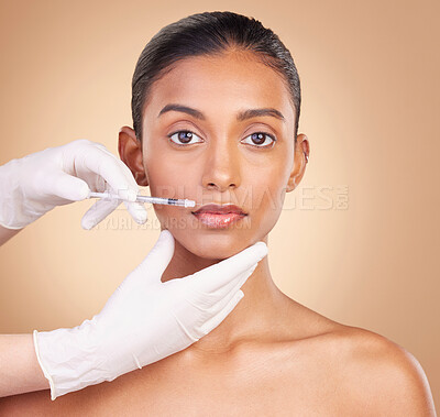 Buy stock photo Woman, face and needle in portrait with beauty and dermatology, skincare with plastic surgery on studio background. Female, hands and injection, cosmetic procedure with facelift treatment and skin