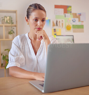 Buy stock photo Laptop focus, thinking and business woman, fashion designer or stylist review design, illustration or digital sketch. Office reading, creativity and serious person contemplating creative trend idea