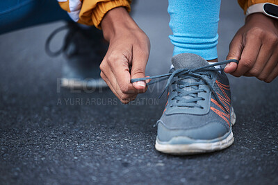 Woman, hands or shoelace tie in fitness training, exercise or workout in urban cardiology, wellness or athlete sports. Zoom, laces or running shoes for runner on road, city street or outdoor marathon