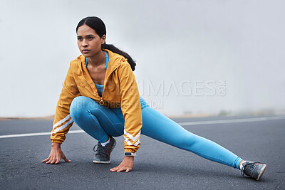 Buy stock photo Fitness leg stretching, woman and runner exercise on a outdoor road in the mountains with focus. Workout, running training and wellness of a young female ready for sports and marathon run in mist
