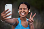 Selfie, peace and fitness with a sports woman outdoor, taking a picture during her cardio or endurance workout. Exercise, running and smile with a happy young female athlete posing for a photograph