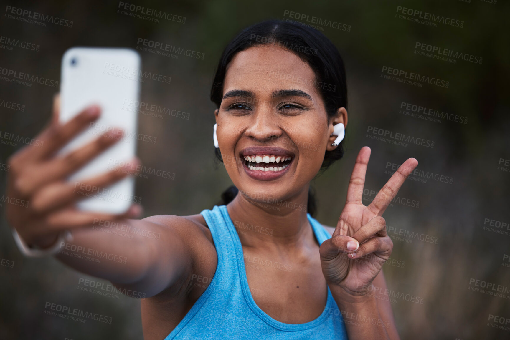 Buy stock photo Selfie, peace and fitness with a sports woman outdoor, taking a picture during her cardio or endurance workout. Exercise, running and smile with a happy young female athlete posing for a photograph
