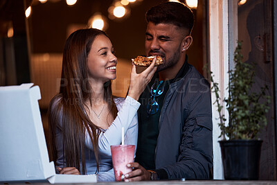 Buy stock photo Pizza, restaurant and happy couple feeding fast food on playful romantic date for Valentines Day, bonding and quality time together. Hungry, love and fun eating girlfriend and boyfriend at shop store
