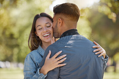 Buy stock photo Couple, outdoor and kiss on cheek with a smile for love, care and happiness together in summer. Young man and woman at nature park for affection or hug on happy and romantic date or vacation to relax