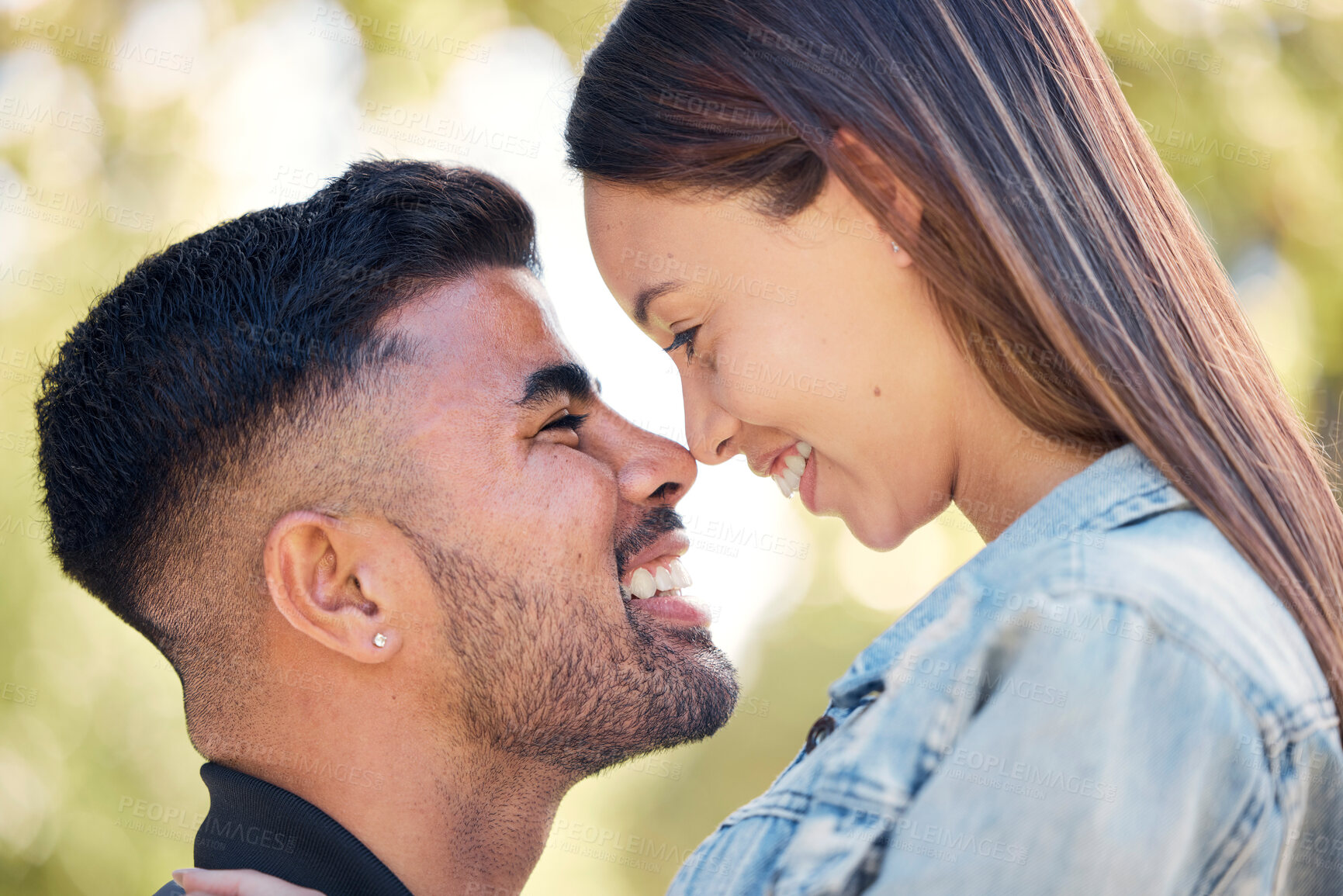 Buy stock photo Face, smile and a couple in the garden together, feeling happy while dating for romance in summer. Love, park or spring with a man and woman bonding outside in nature as a romantic partnership