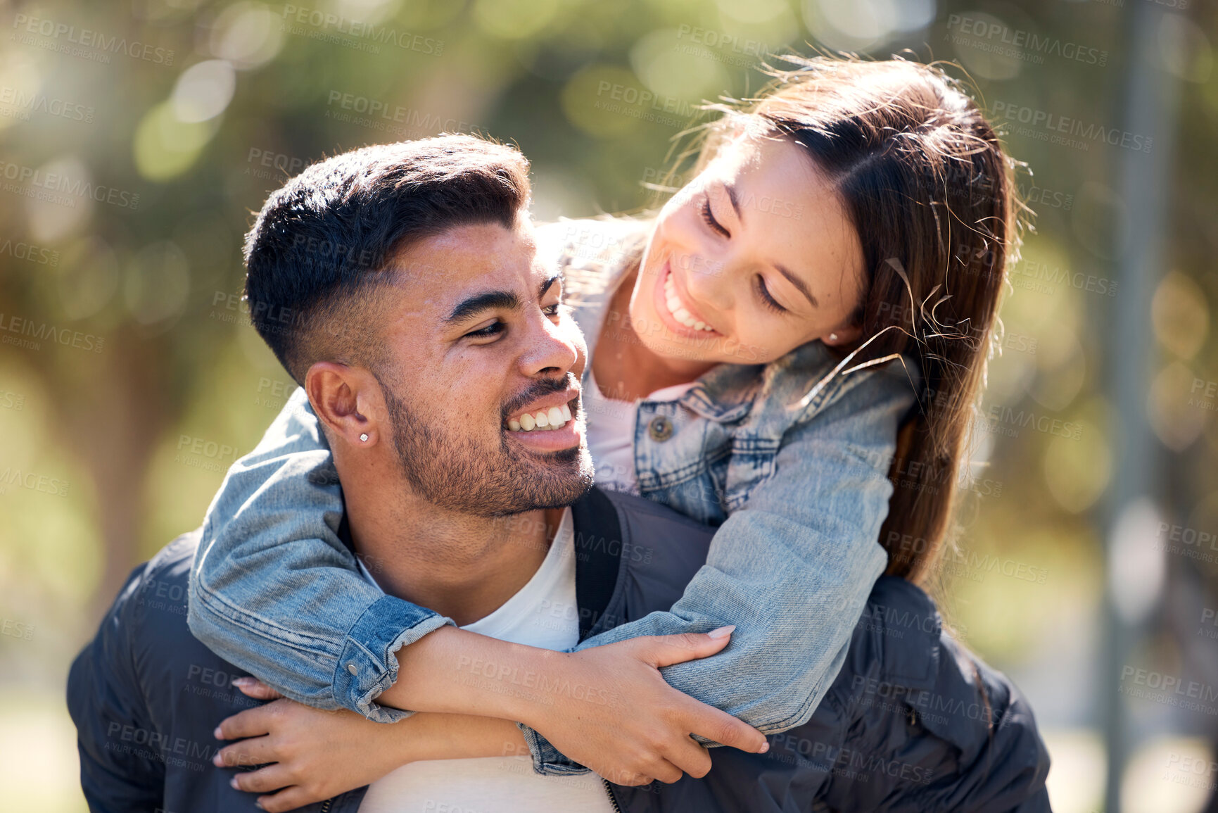 Buy stock photo Couple, outdoor and piggy back with a smile for love, care and happiness together in summer. Young man and woman at nature park for affection or hug on a happy and romantic date or vacation to relax