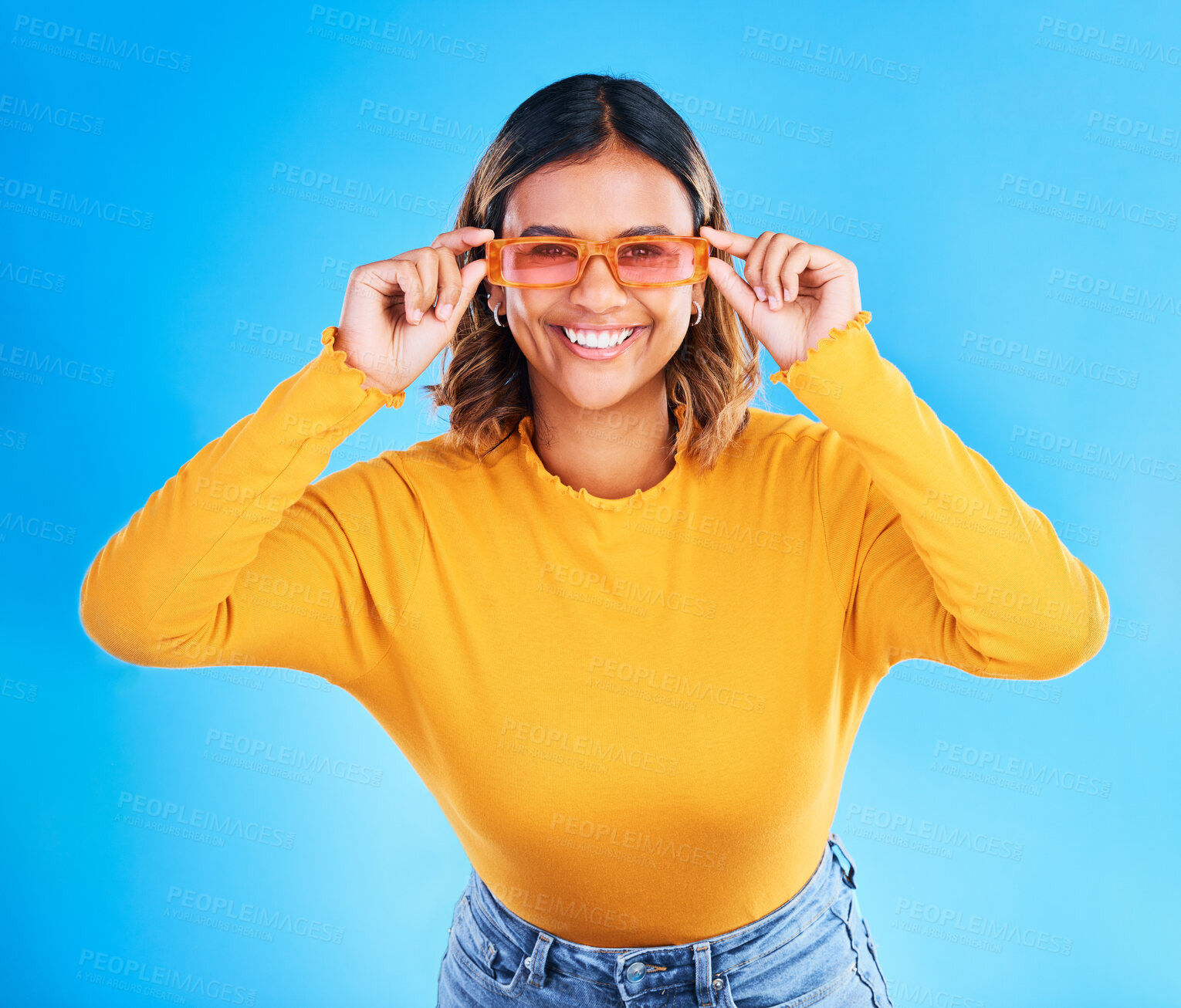 Buy stock photo Fashion glasses, happy portrait and woman face with clothes, luxury designer brand or casual outfit style. Gen z summer aesthetic, trendy studio sunglasses and young female model on blue background