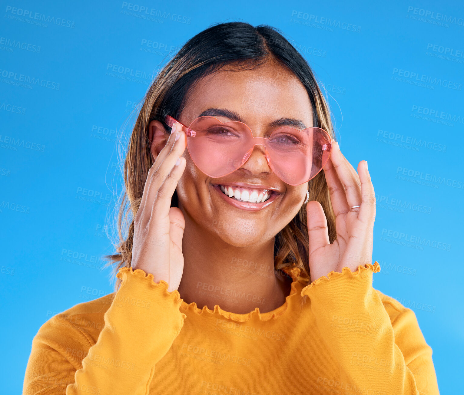 Buy stock photo Fashion, smiling or woman portrait with heart glasses, luxury designer brand style or casual summer outfit. Gen z aesthetic, trendy sunglasses accessory or female face model on blue background studio
