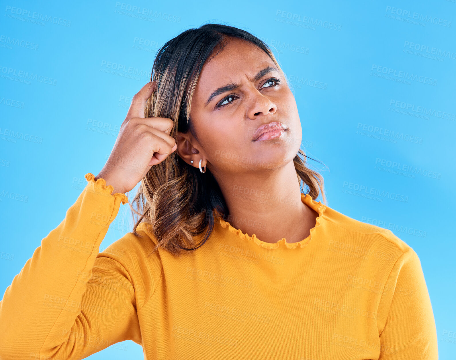 Buy stock photo Thinking, confused and pensive woman in a studio with an idea, thoughtful or contemplating face expression. Deciding, doubtful and female model with wonder scratching head gesture by blue background.