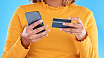 Woman hands, credit card and phone in studio for online shopping, digital fintech payment and customer money. Closeup female, ecommerce and mobile banking for finance, cash economy or sales promotion