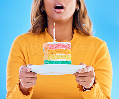 Buy stock photo Birthday cake, celebration and blowing a candle to celebrate a gift or present isolated in a studio blue background. Dessert, sweet and woman or person excited, happiness and happy for festive