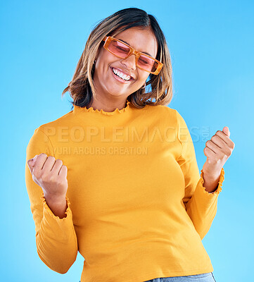 Buy stock photo Fashion celebration, excited or happy woman, studio winner and celebrate victory, luxury designer brand or casual outfit style. Success, winning achievement and gen z female cheers on blue background