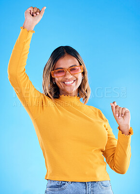 Fashion glasses, celebration portrait and happy woman with clothes, luxury designer brand or casual outfit style. Gen z summer aesthetic, trendy studio sunglasses or excited female on blue background