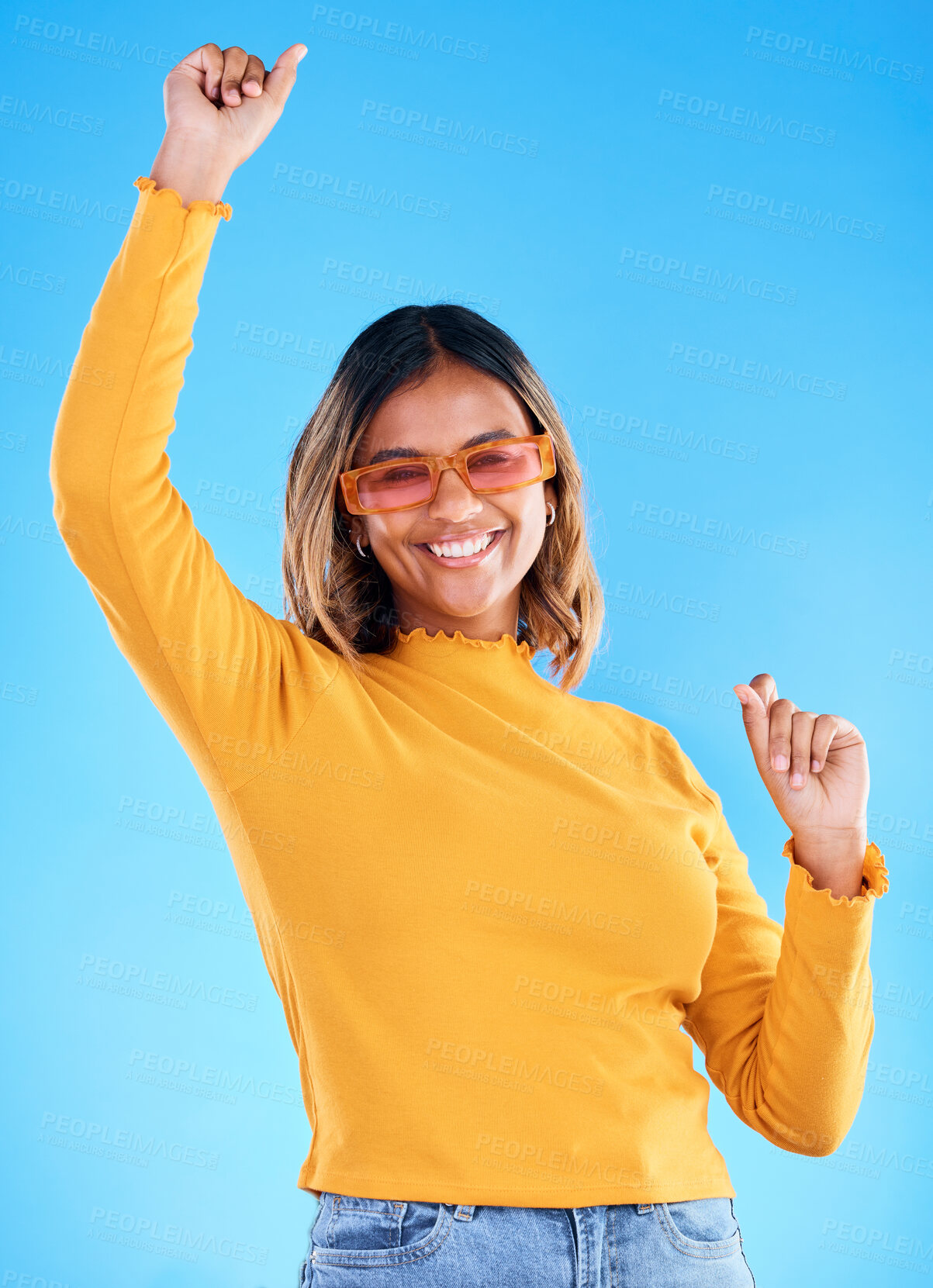 Buy stock photo Fashion celebration, portrait dance and happy woman, studio winner and celebrate victory, happiness or freedom. Winning achievement success, excited dancing and gen z female cheers on blue background
