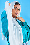 Muslim woman, beauty and portrait of hijab in studio, blue background or color backdrop. Young female model, islamic culture or scarf for religion, arabic fashion and empowerment of elegant style 