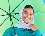 Fashion portrait, Muslim and happy woman with umbrella, luxury designer brand clothes or casual outfit style. Gen z winter aesthetic, teenager face smile or Islamic female on blue background studio