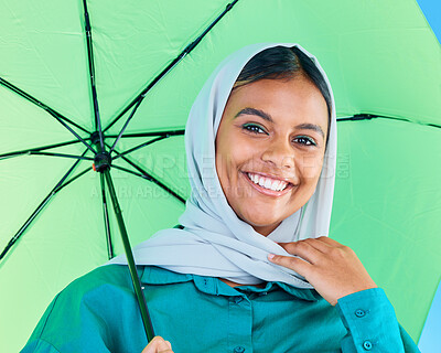 Buy stock photo Fashion portrait, Muslim and happy woman with umbrella, designer brand clothes or casual outfit style. Trendy gen z winter aesthetic, beauty smile and face of Arabic Islamic female in studio