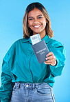 Portrait, passport and young woman isolated on blue background for USA travel opportunity, immigration or holiday. Identity documents, flight ticket and happy face of indian person or model in studio