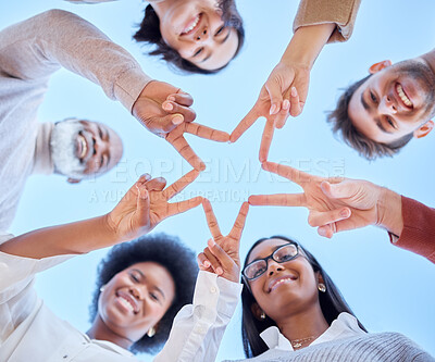 Buy stock photo Star, low angle or happy team with peace sign, diversity or community collaboration with blue sky. Portrait, smile or group of people smiling with support, solidarity or motivation together outdoors 