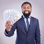 Portrait, money and investment with a business black man in studio on a gray background as a lottery winner. Cash, accounting and finance with a male employee holding dollar bills for the economy