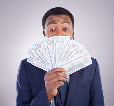 Buy stock photo Eyes, cash and investment with a business black man in studio on a gray background as a lottery winner. Money, accounting and finance with a male employee holding dollar bills for the economy