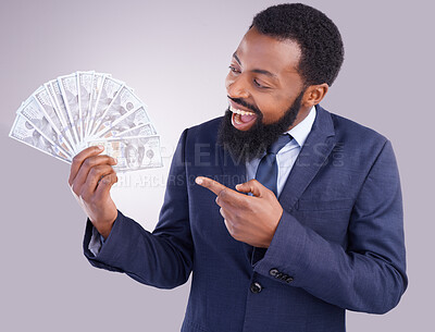 Buy stock photo Wow, money and investment with a business black man in studio on a gray background as a lottery winner. Cash, accounting and finance with a male employee pointing to dollar bills for the economy