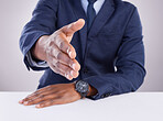 Handshake, offer and closeup of man in white background for business networking, thank you and meeting HR. Corporate male stretching to shake hands in studio for recruitment, welcome and partnership 