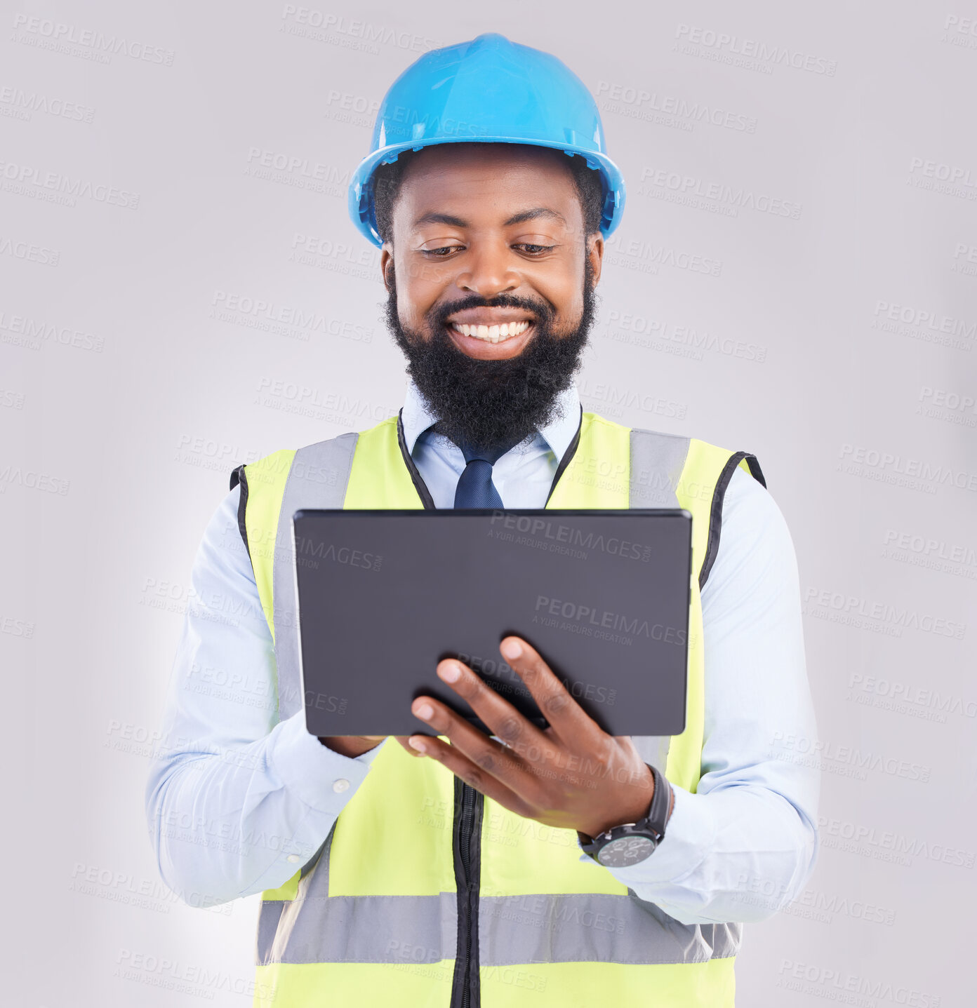 Buy stock photo Black man, engineer and tablet in studio for construction with smile for architecture, design or building. Architect, mobile touchscreen and excited face for property, development and project on app