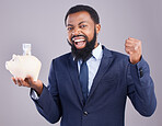 Black man, piggy bank and celebration for financial investment or savings against white studio background. Portrait of excited African businessman holding cash or money pot for winning and investing