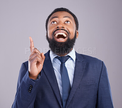 Buy stock photo Wow, pointing and promotion with a business black man in studio on a gray background for motivation. Winner, hand gesture and announcement with a corporate male employee celebrating success