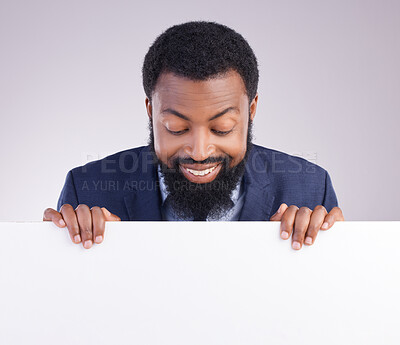 Buy stock photo Mockup, happy and a black man looking at a board isolated on a white background in a studio. Smile, banner and an African businessman with a poste, reading space and showing a commercial message