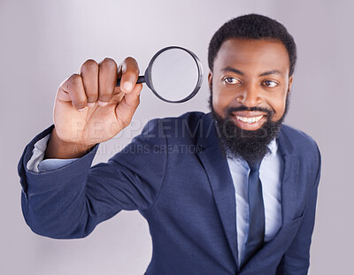 Buy stock photo Corporate black man, magnifying glass and studio with smile for quality inspection, compliance and fair trade. Businessman, inspector and audit at company with attention for financial health at job