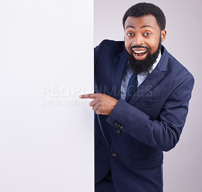 Buy stock photo Business portrait, excited man and pointing to board in white background, studio or mockup space. Corporate worker, black male and advertising poster, marketing wow news and banner on blank mock up 