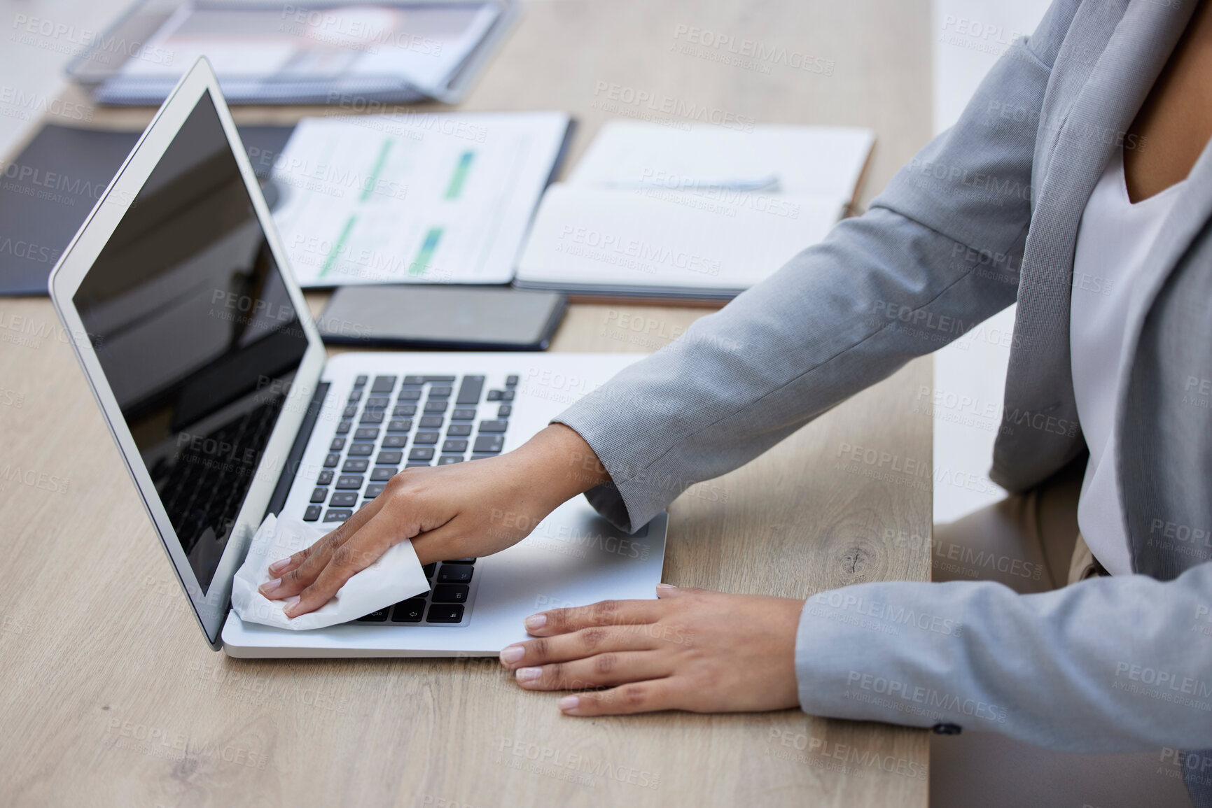 Buy stock photo Hands, laptop or cleaning cloth for hygiene, wellness or bacteria protection in modern corporate office. Business woman, technology or wiping dust for health maintenance, safety or virus disinfection