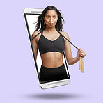 Woman, phone and screen on mockup for fitness, advertising or marketing against a studio background. Portrait of active fit female with skipping rope on mobile smartphone display for advertisement