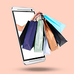 Hands, phone and screen on mockup with shopping bags for purchase, advertising or marketing against a studio background. Hand of shopper with gifts on mobile smartphone display for online ecommerce