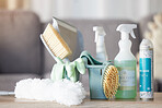 Cleaning equipment, detergent and tools on table for housekeeping, clean supplies or service in living room at home. Hygiene products on counter for sanitizing, washing or disinfection services