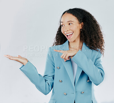 Buy stock photo Business woman, pointing and studio with palm for mockup, promotion or space by white background. Happy entrepreneur, smile and open hand for product placement, mock up or happiness for company promo