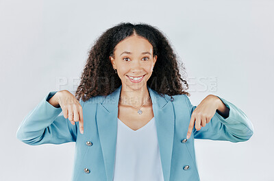 Buy stock photo Business woman, pointing down and studio portrait for mockup, promotion and space by white background. Happy entrepreneur, smile and hand sign for suggestion, mock up and happiness for company promo