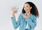 Portrait, pointing and cash with a business woman in studio on a gray background for financial freedom. Smile, finance and money with a happy female employee holding euro bills for investment