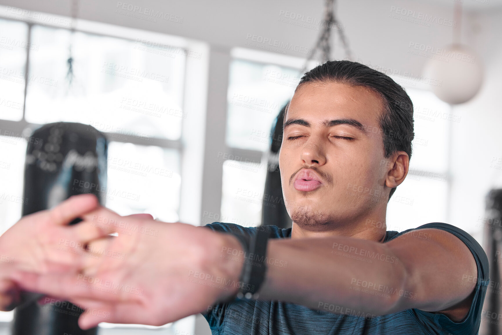 Buy stock photo Hands, stretching fingers and man in gym ready to start workout, training or exercise. Sports fitness, health and serious male athlete warm up, stretch or prepare for exercising for flexibility.