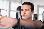 Hands, stretching fingers and man in gym ready to start workout, training or exercise. Sports fitness, thinking and serious male athlete warm up, stretch or prepare for exercising for flexibility.