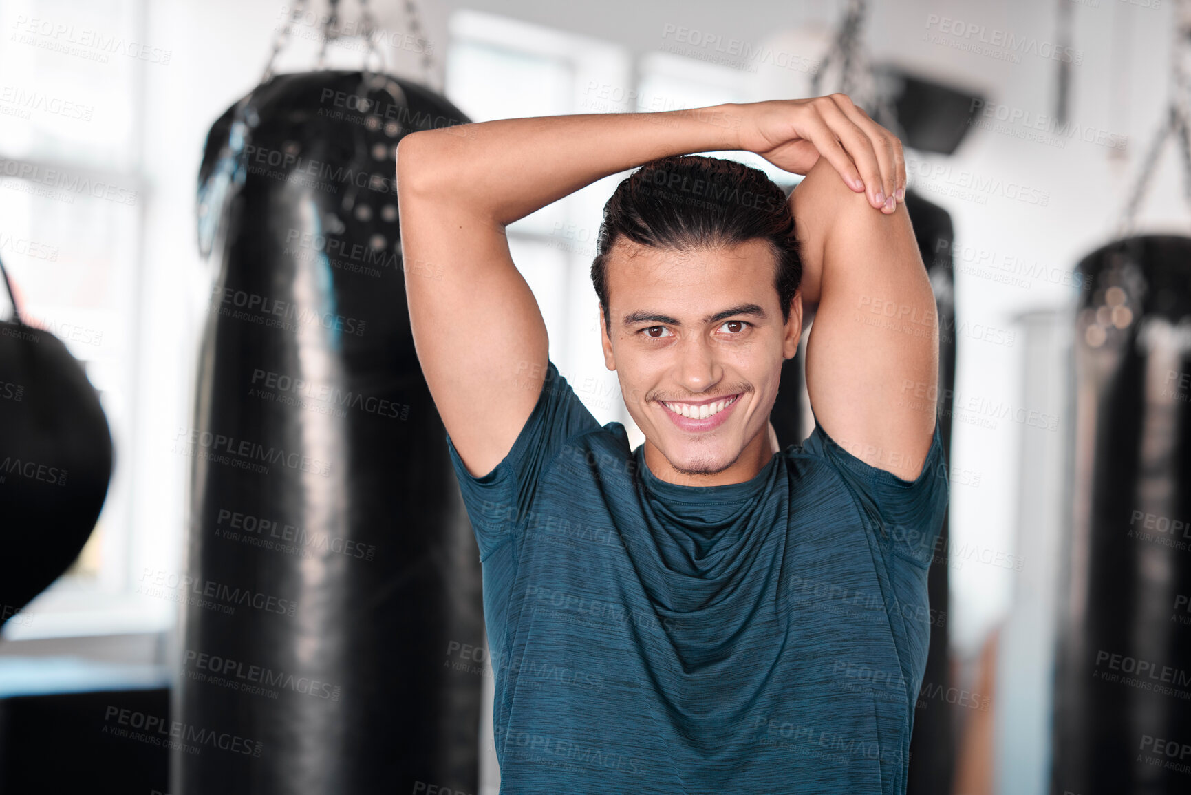 Buy stock photo Portrait, stretching arm and man in gym ready to start workout, training or exercise. Sports smile, health fitness and happy male athlete warm up, stretch or prepare for exercising for flexibility.