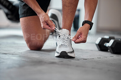 Buy stock photo Fitness, hands and tie shoes in gym to start workout, training or exercise. Sports, athlete and man tying footwear or sneakers to get ready or prepare for running, cardio or exercising for health.