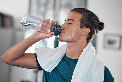 Buy stock photo Fitness, man and drinking water for hydration after workout, exercise or intense training at home. Thirsty male resting from sports exercising for hydrated wellness, health and fresh natural drink