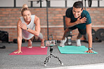 Live streaming, phone fitness and people in exercise teamwork, workout and social media video on tripod. Happy athlete training, influencer couple of friends or sports content creation on smartphone