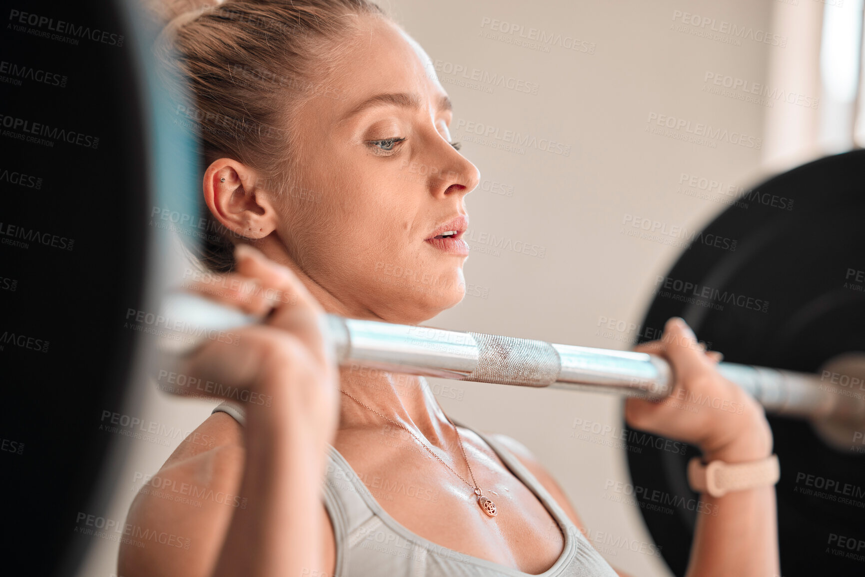 Buy stock photo Exercise, weightlifting and a woman bodybuilder in the gym for a workout to build a strong muscular physique. Fitness, bodybuilding and a female weightlifter training her body in a wellness center