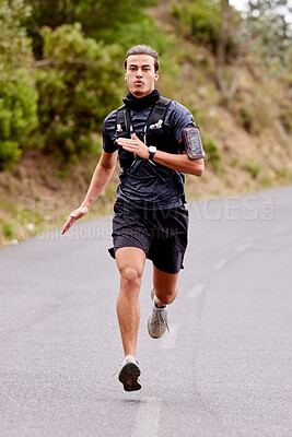 Running, fitness and portrait of man runner for outdoor training or exercise goals, challenge and sports health in nature. Young, fast and speed of serious athlete in cardio workout on road or street