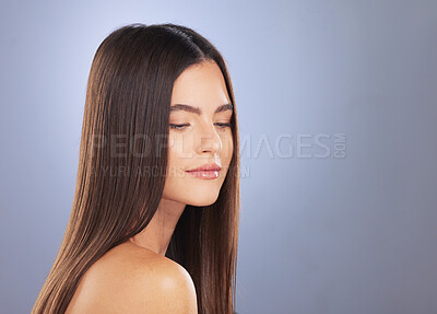 Buy stock photo Woman, beauty and hair with space in studio for face, growth and healthy shine on blue background. Aesthetic female for haircare, self care and cosmetics mockup for salon or hairdresser treatment