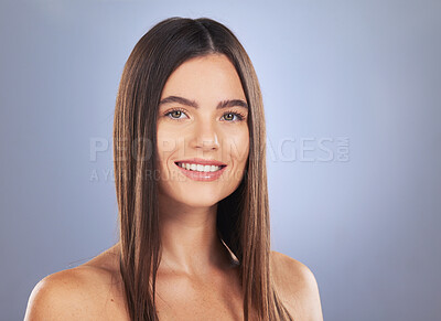 Buy stock photo Woman, beauty and hair care portrait in studio for glow, growth or healthy shine on blue background. Aesthetic female model smile for haircare, self love and cosmetic for salon or hairdresser results